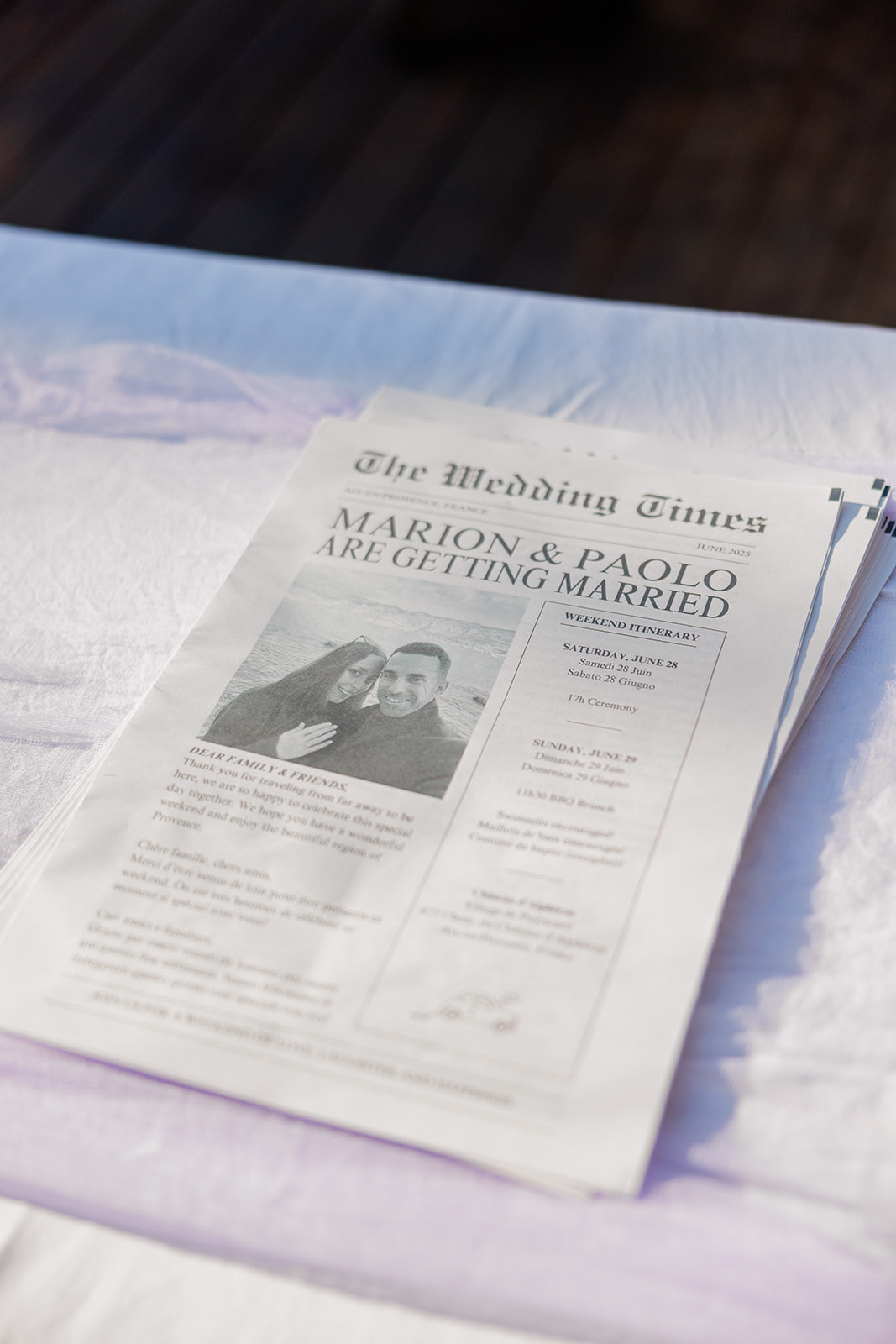 wedding newspaper on a table with provence lavender color table cloth
