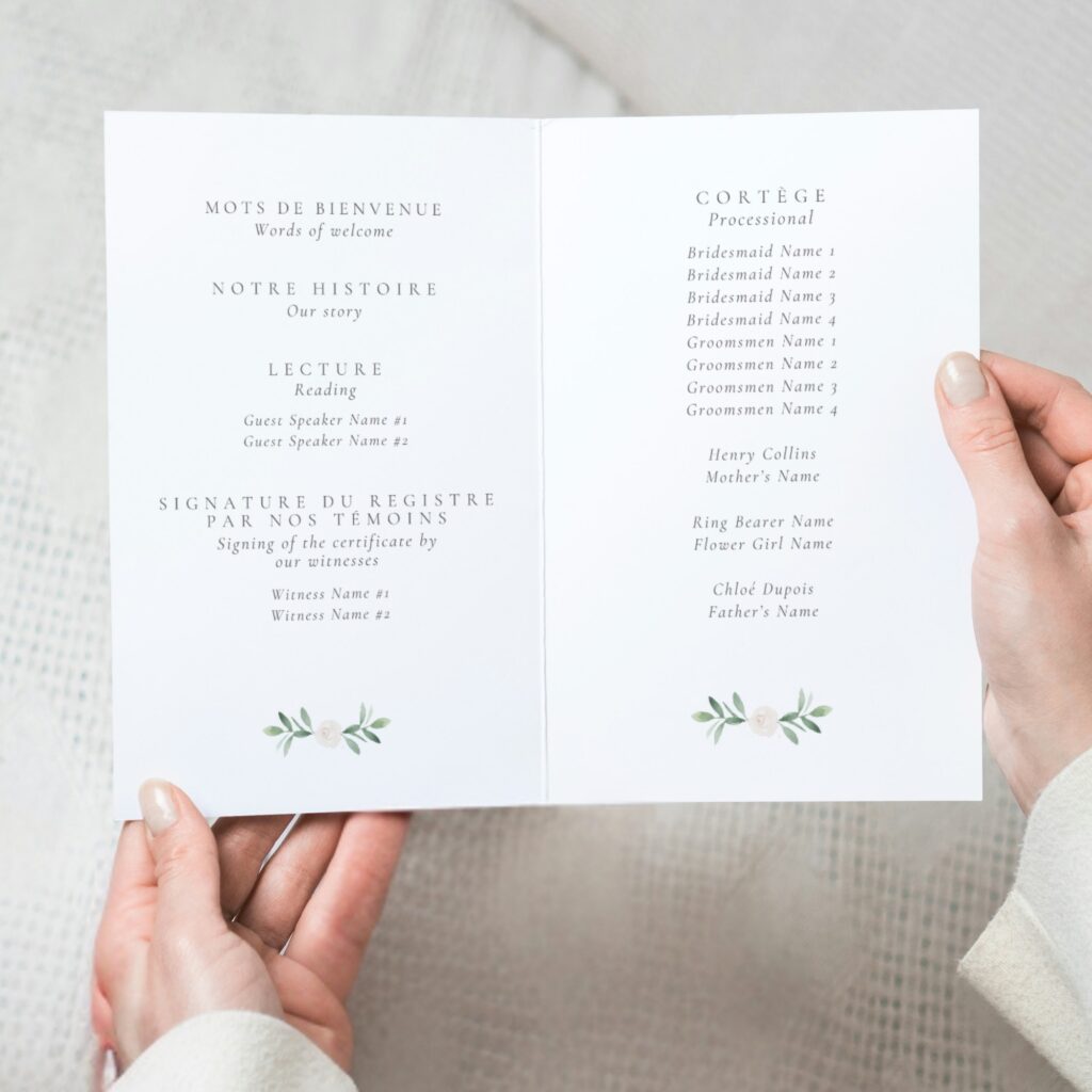 hand holding bilingual ceremony program for multicultural wedding